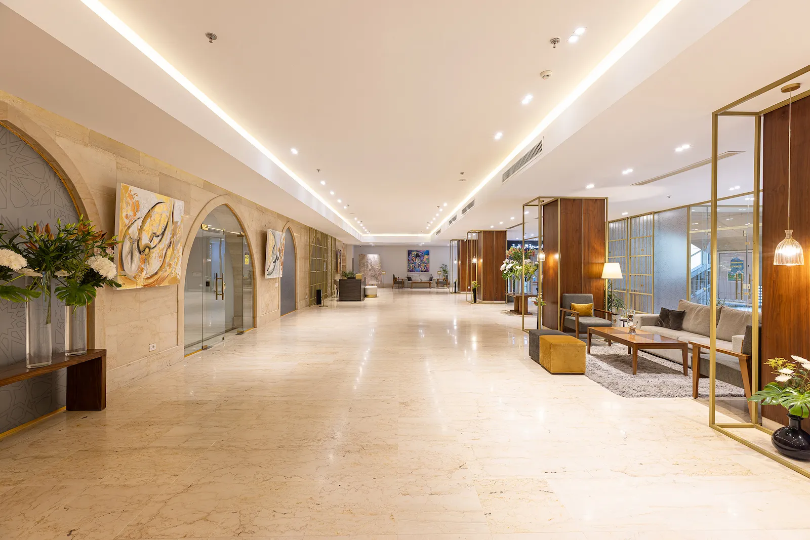 Lobby corridor with timber panelling and brass-toned screens