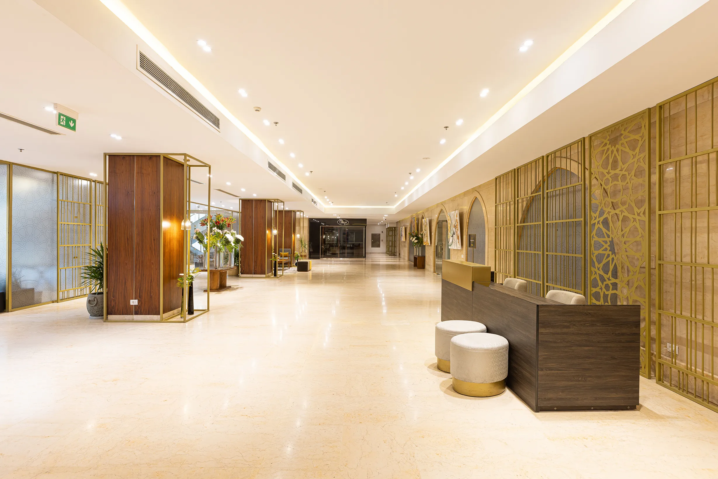 The ICONIA Zamalek lobby with marble floors and arched details
